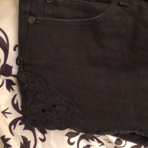 Black cut off shorts with lace embellishment